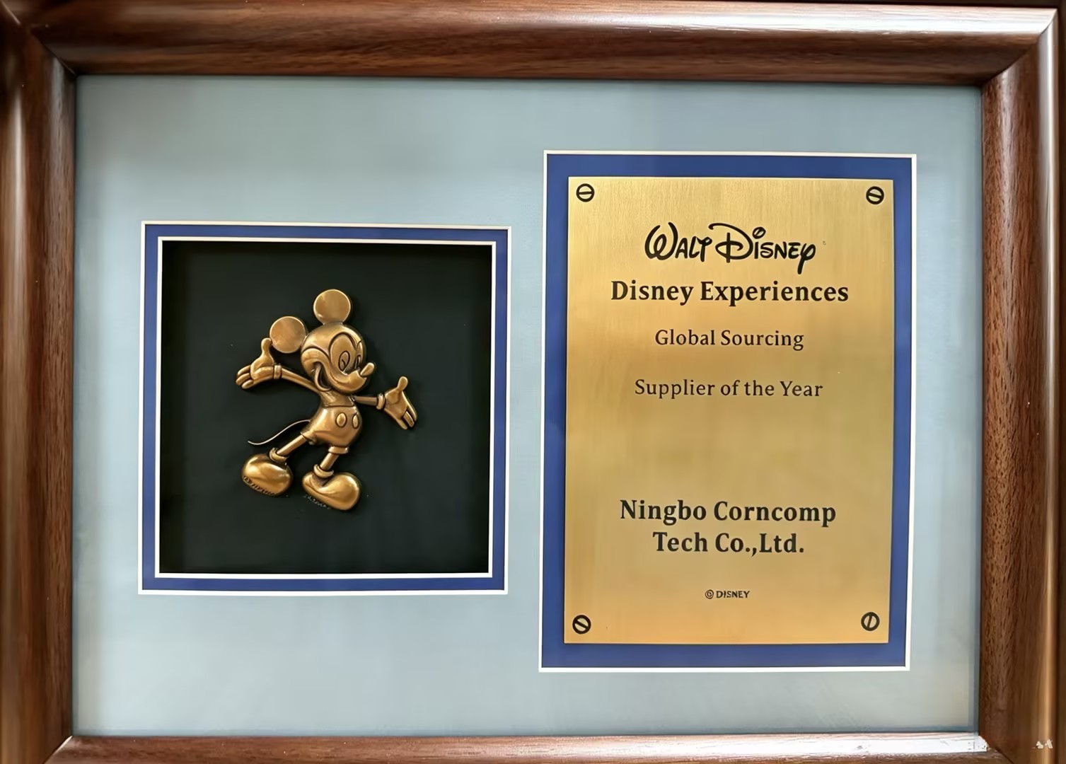 Walt Disney Disney Experiences Global Sourcing Supplier of the Year award plaque presented to Ningbo Corncomp Tech Co., Ltd